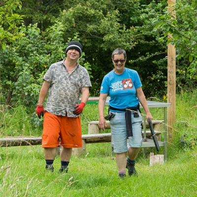 Volunteers walking through the community garden